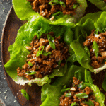 Ground turkey lettuce wraps filled with savory turkey, crunchy vegetables, and fresh scallions on crisp lettuce cups.
