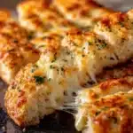 cheesy breadsticks with a golden crust and melty c 2026 02 11 151423 819x1024 1