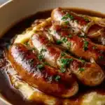 sausages in gravy hearty homestyle dish with deep 2026 03 23 181009 819x1024 1